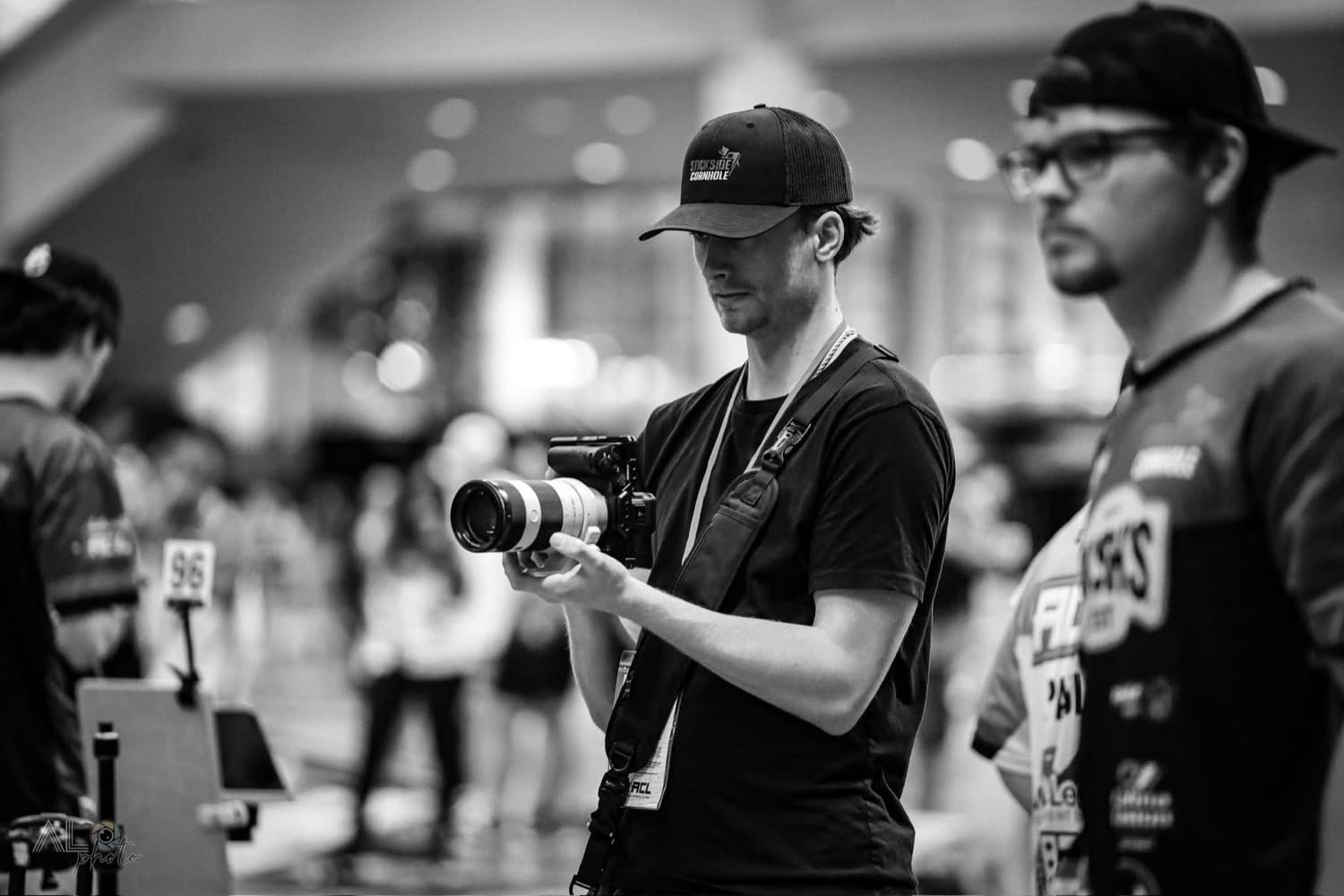Zack filming content at a cornhole event