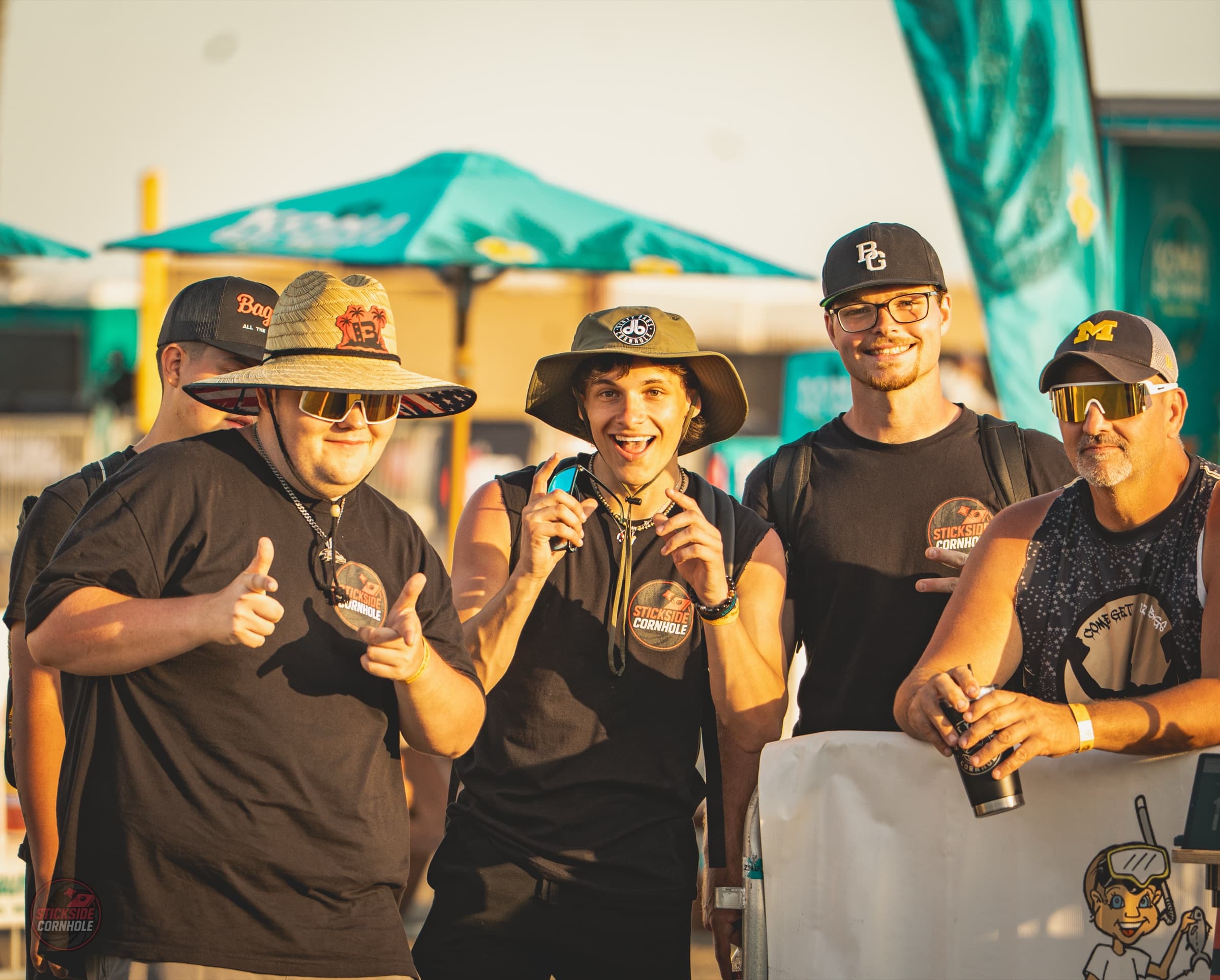 The crowd and players at a Stickside cornhole event